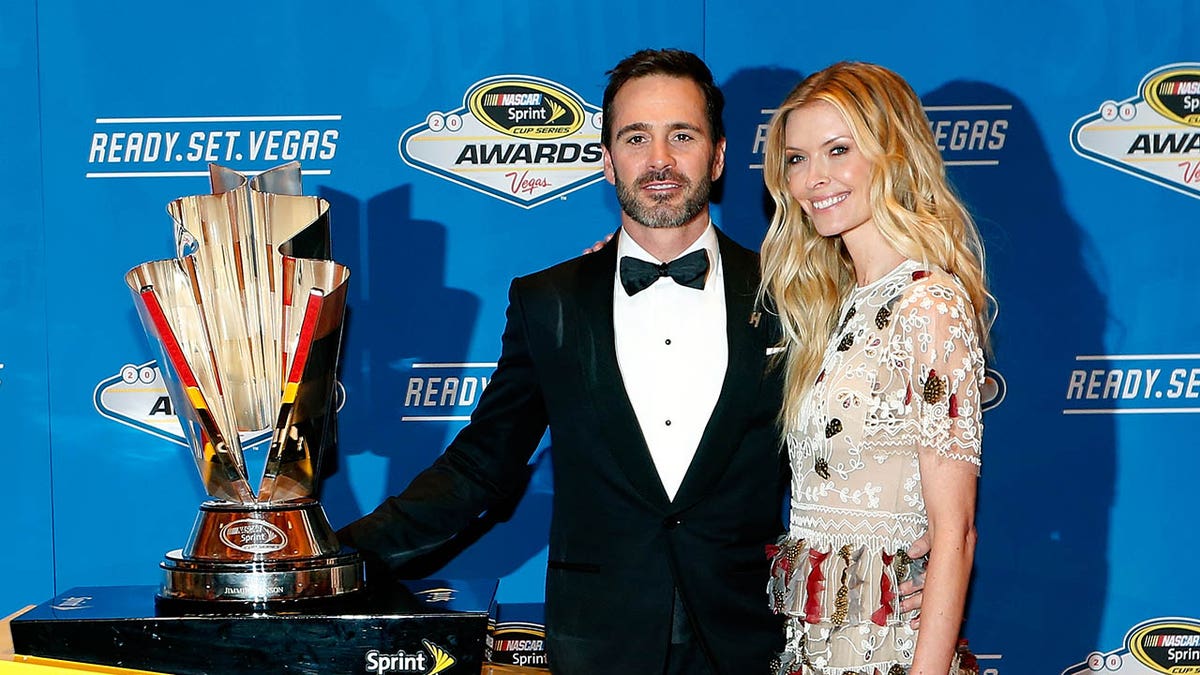 Jimmie Johnson and his wife Chandra pose for a picture