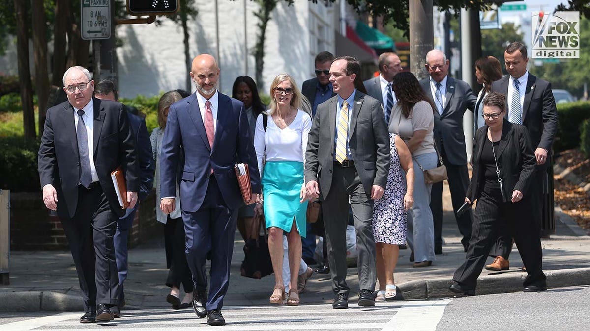 Holloway family and friends walking outside