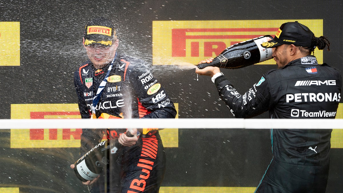 Lewis Hamilton sprays Max Verstappen