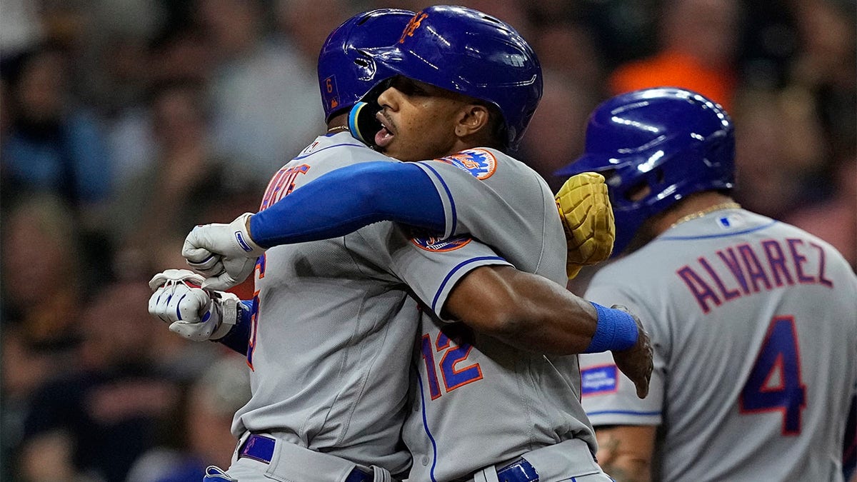 Fransisco Lindor celebrates with Starling Marte