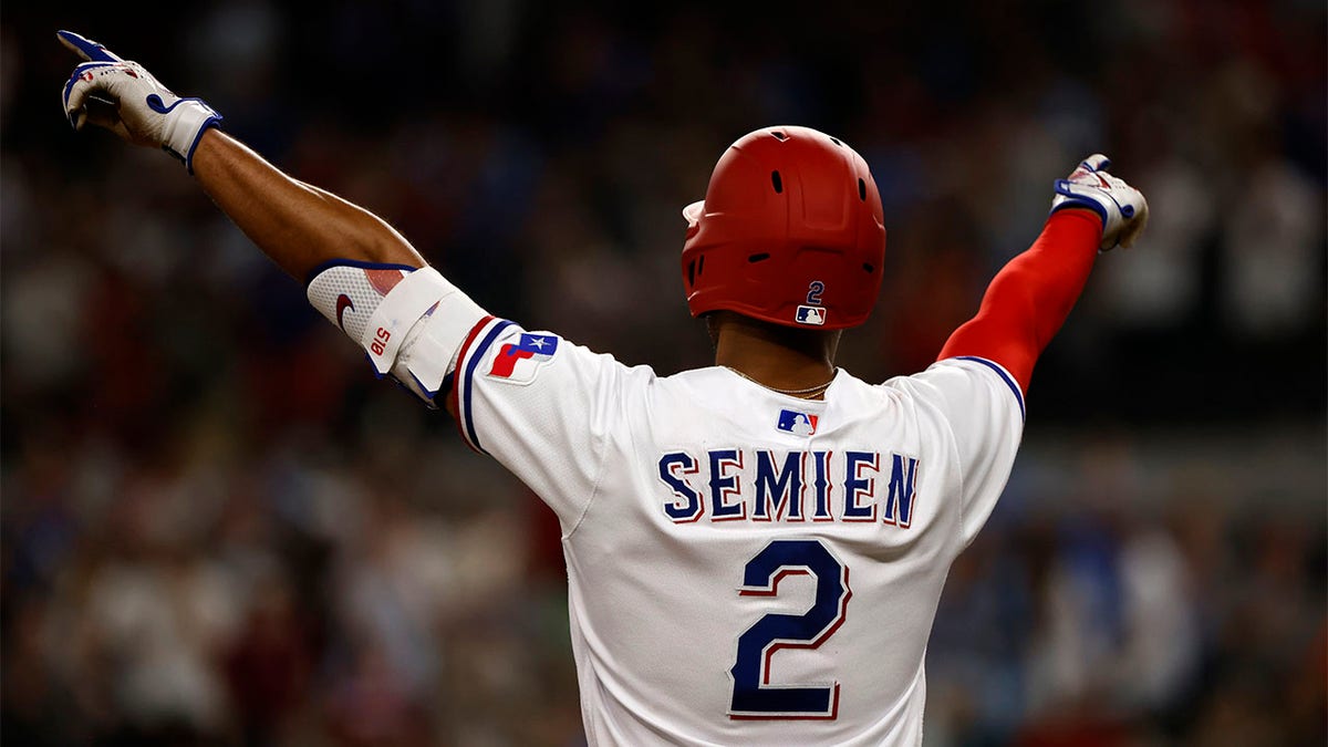 Marcus Semien celebrates after hitting double