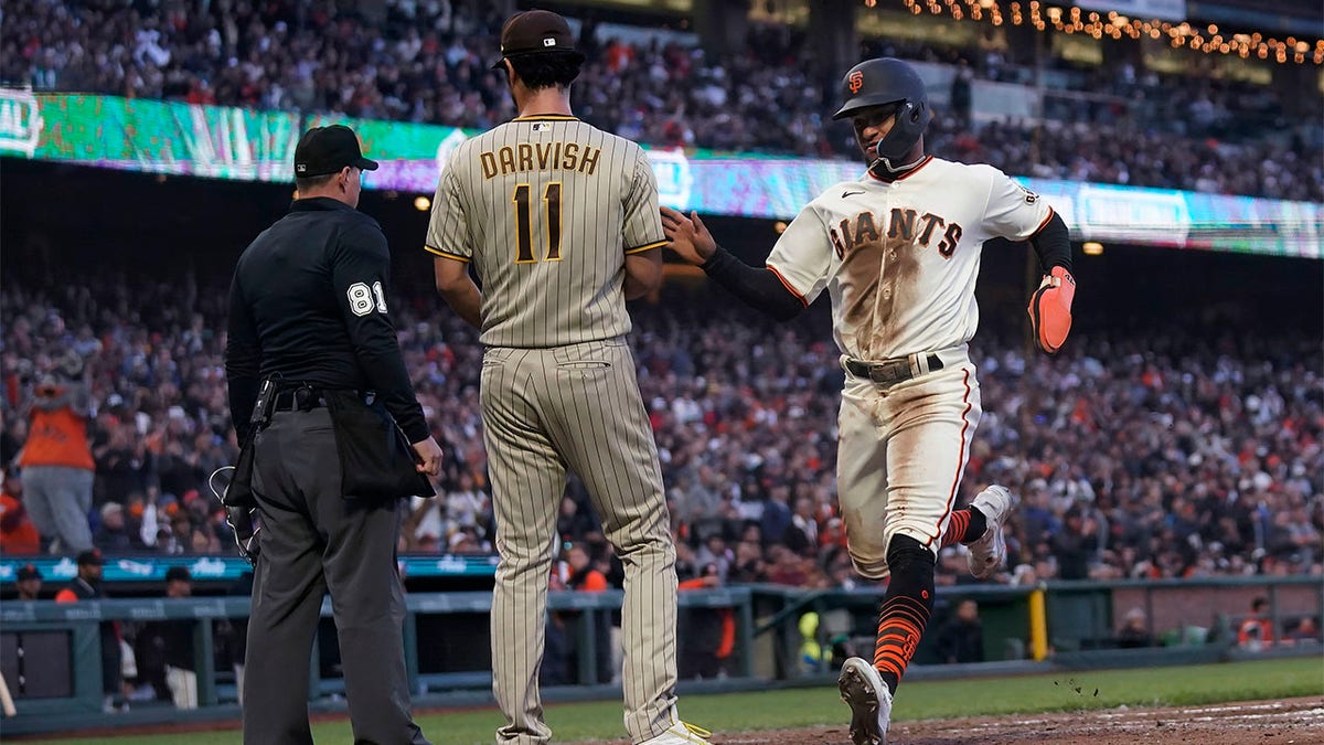 Luis Matos runs past Yu Darvish