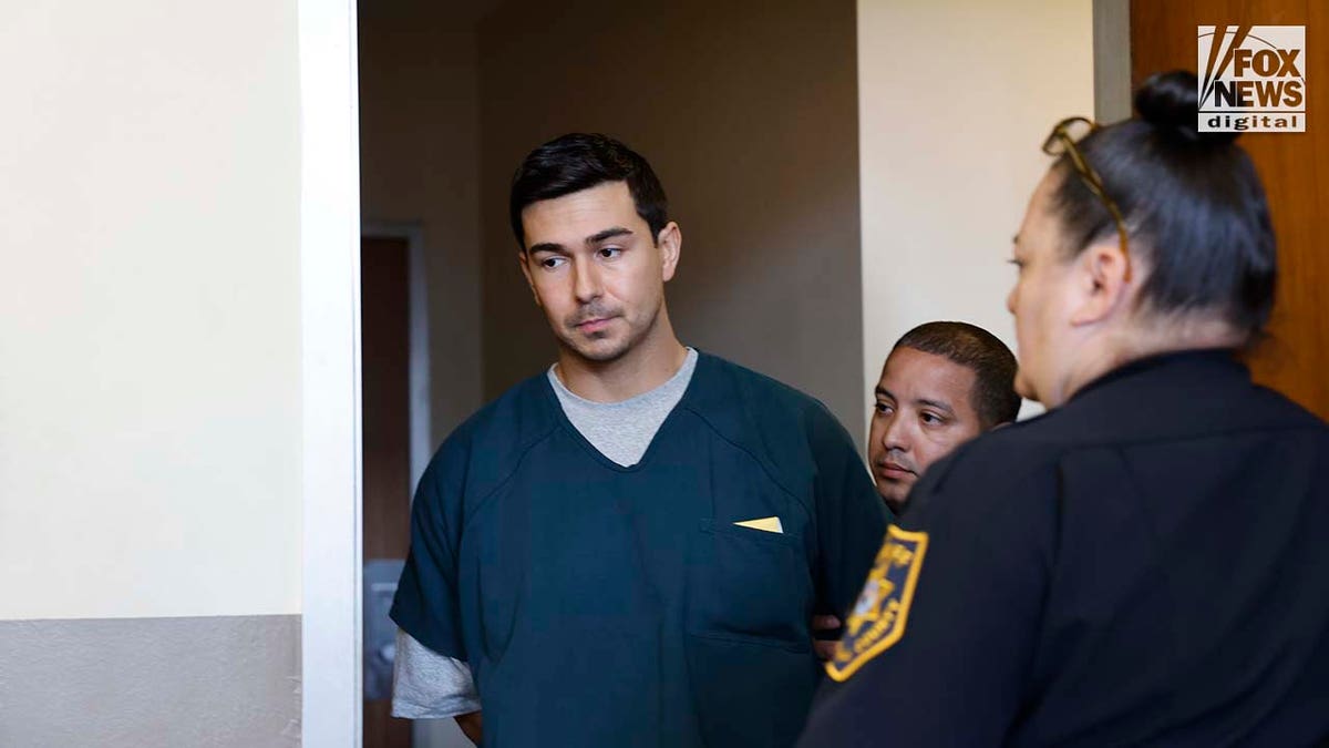 Matthew Nilo at arraignment in blue jail uniform