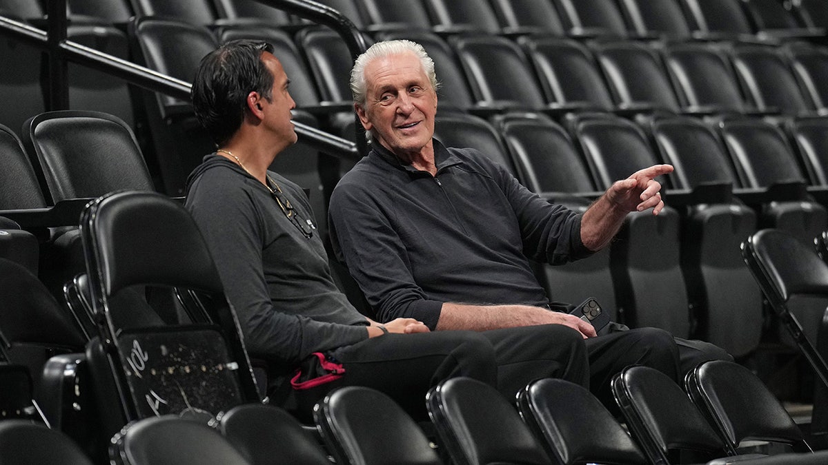 Erik Spoelstra and Pat Riley talk during a Miami Heat practice