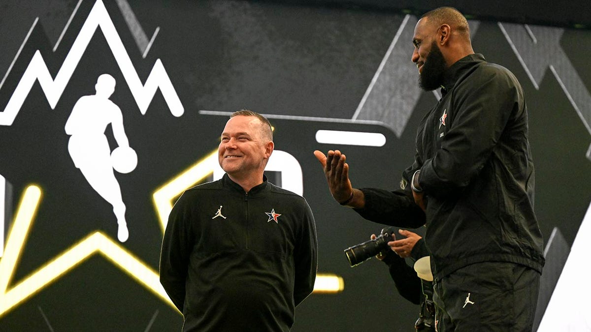 Michael Malone of the Denver Nuggets with LeBron James at the NBA All-Star game