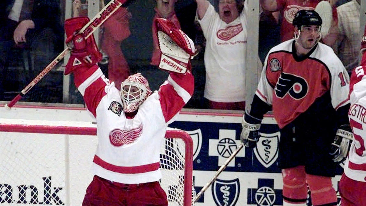 Mike Vernon celebrates after winning Stanley Cup