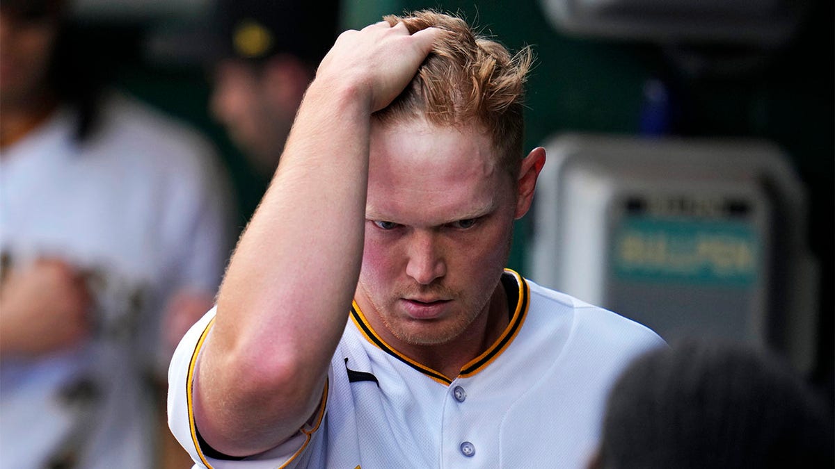 Mitch Keller walks in the dugout