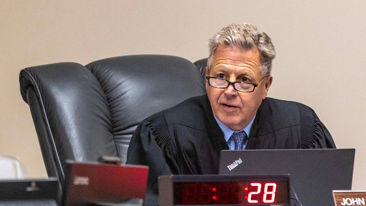 Judge John Judge talks during a hearing