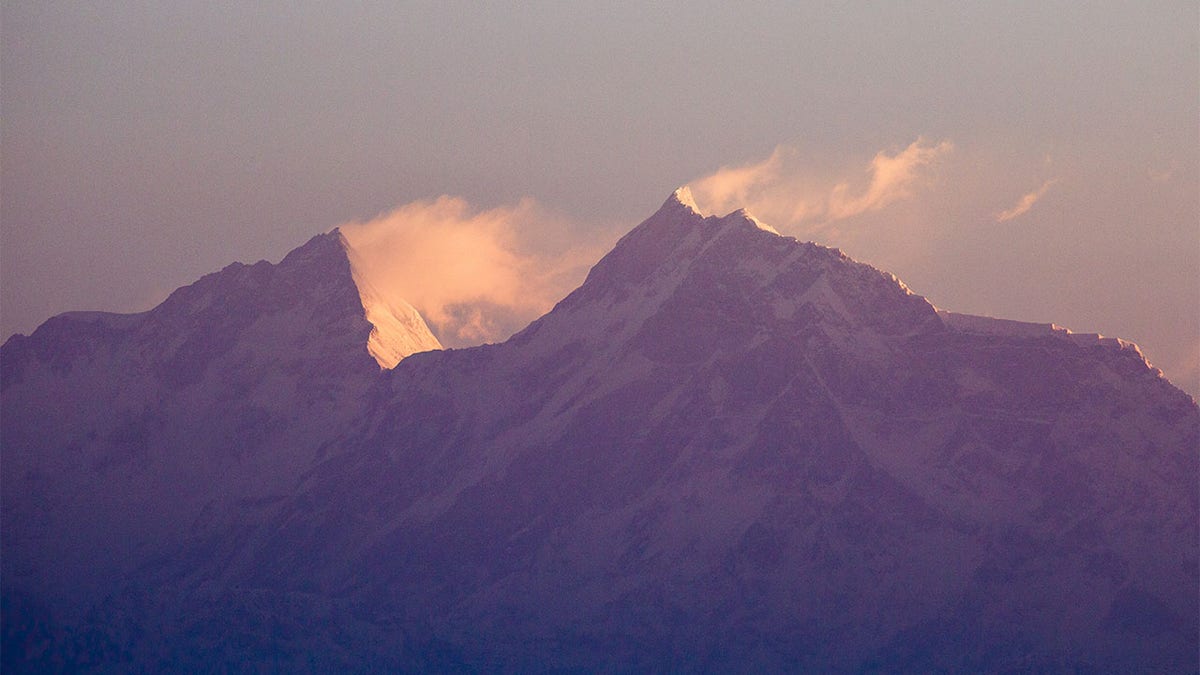 Snow blows off of Mount Manaslu