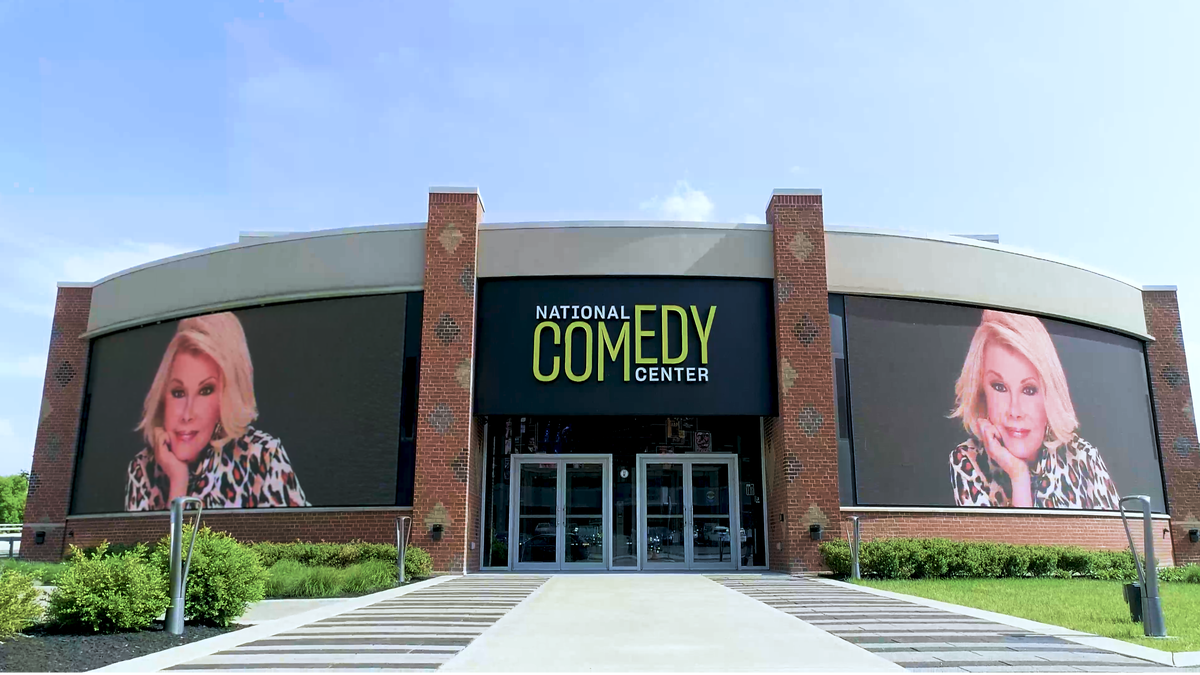 Exterior of the National Comedy Center with Joan Rivers signage.