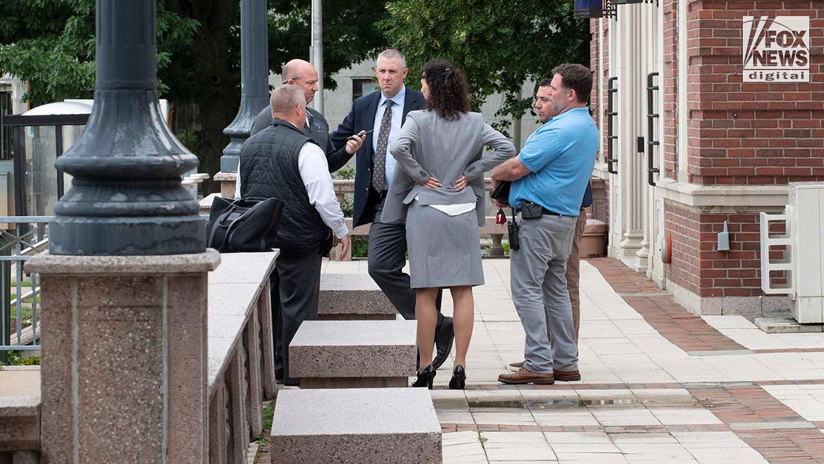 Attorneys speak outside of the Newton District Court