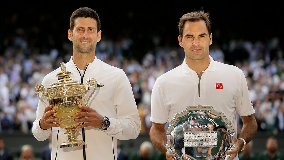 Novak Djokovic and Roger Federer pose