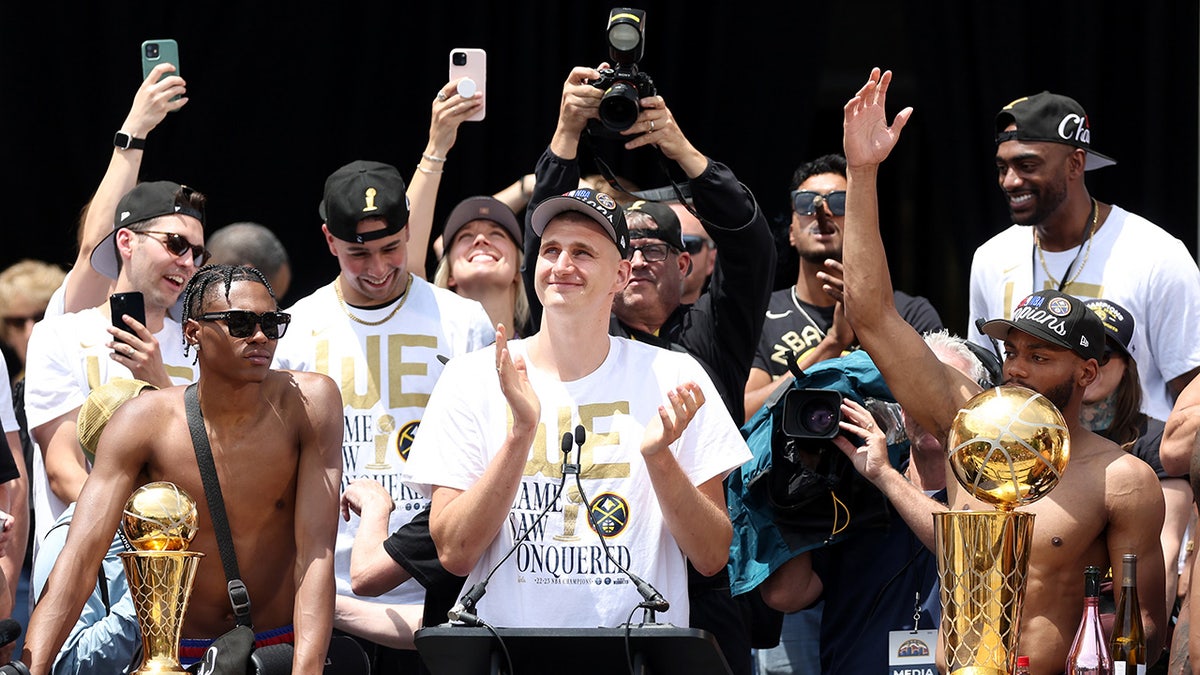 Nikola Jokic's wife got hit in the face with a beer can at the championship  parade. Jokic & his daughter were inches away.