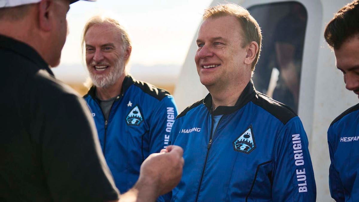 U.K. billionaire Hamish Harding receives a pin after traveling to space on a Blue Origin flight