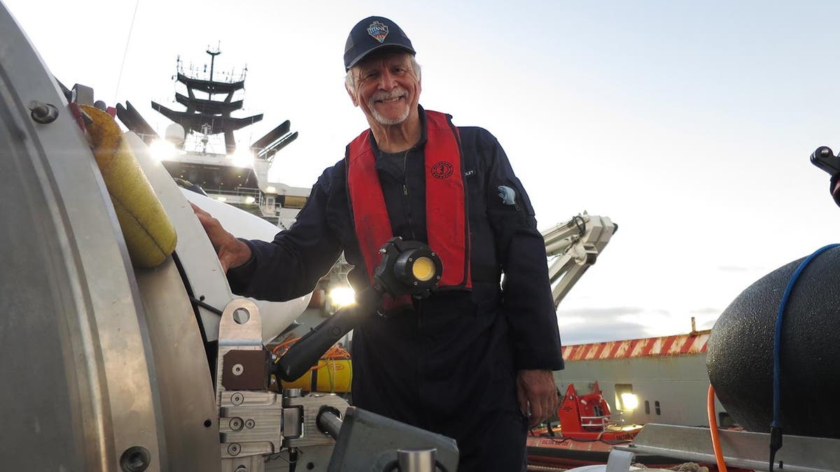 Paul-Henry (PH) Nargeolet poses for a photo alongside OceanGate's Titan submersible