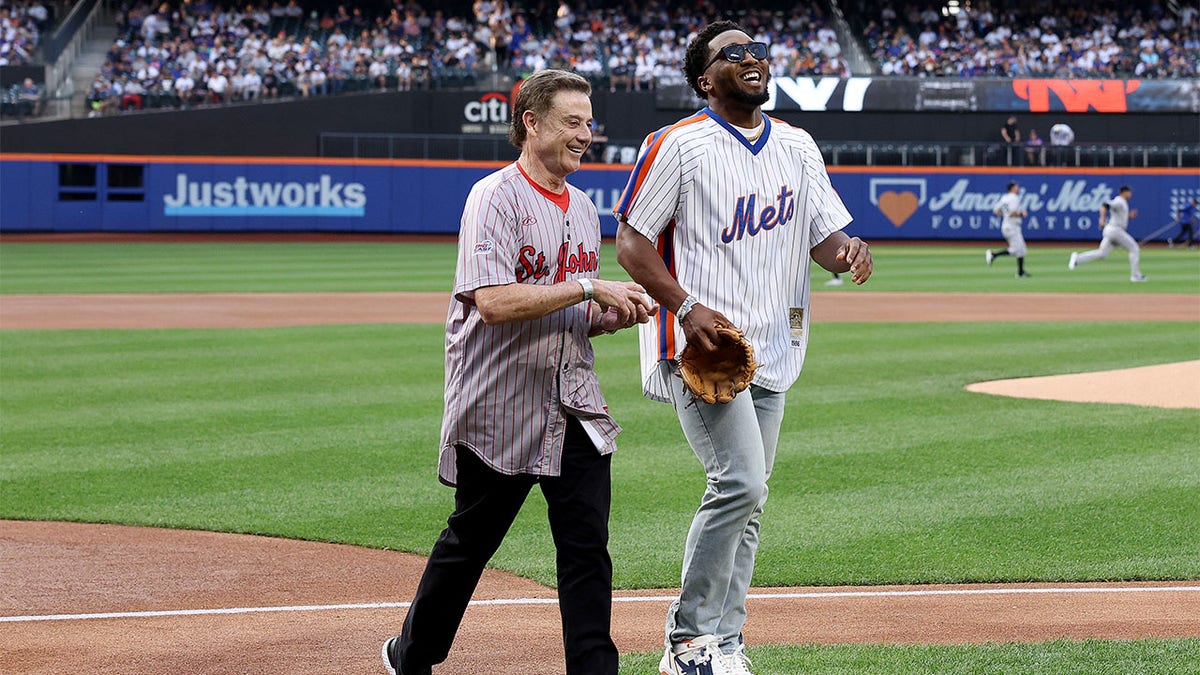 St. John's coach Rick Pitino throws out first pitch to Donovan