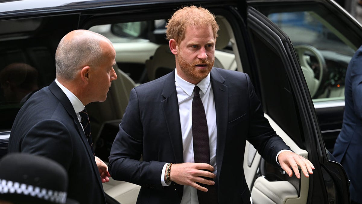 Prince Harry gets out of car at court