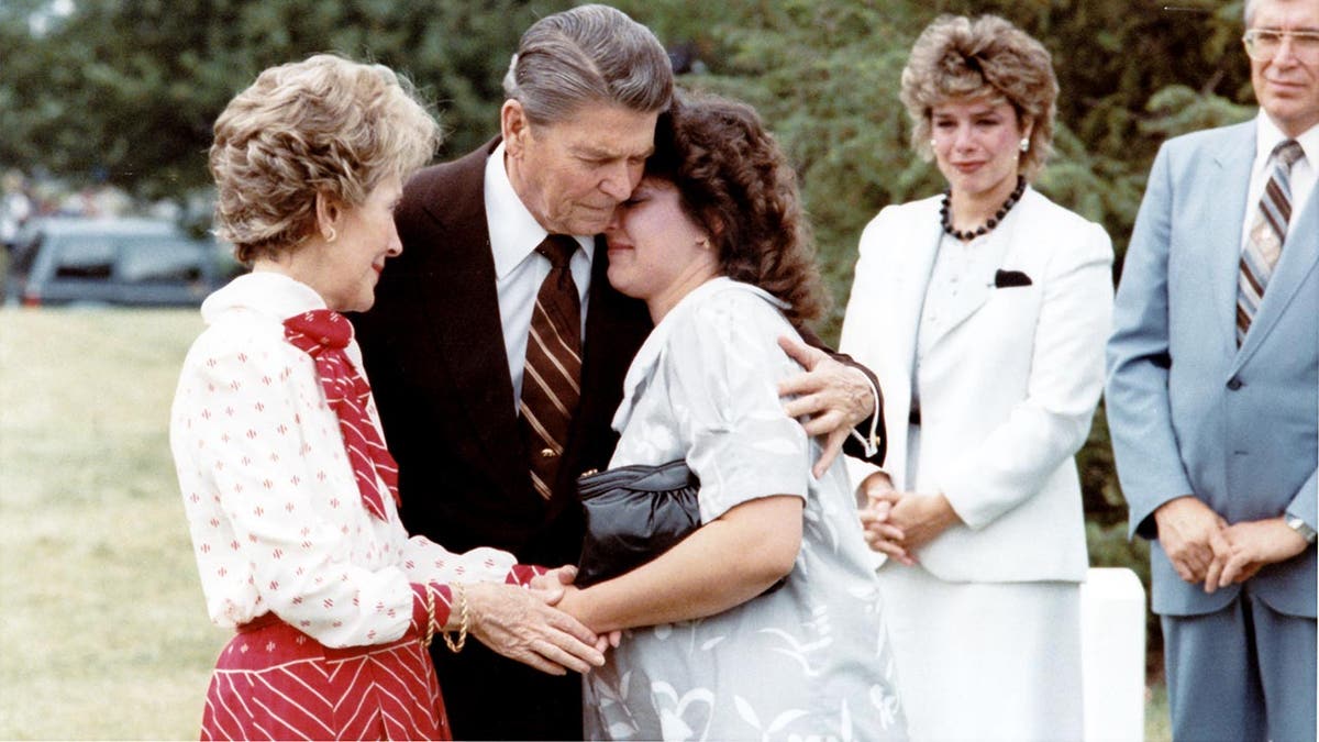 Ronald Reagan comforting supporting