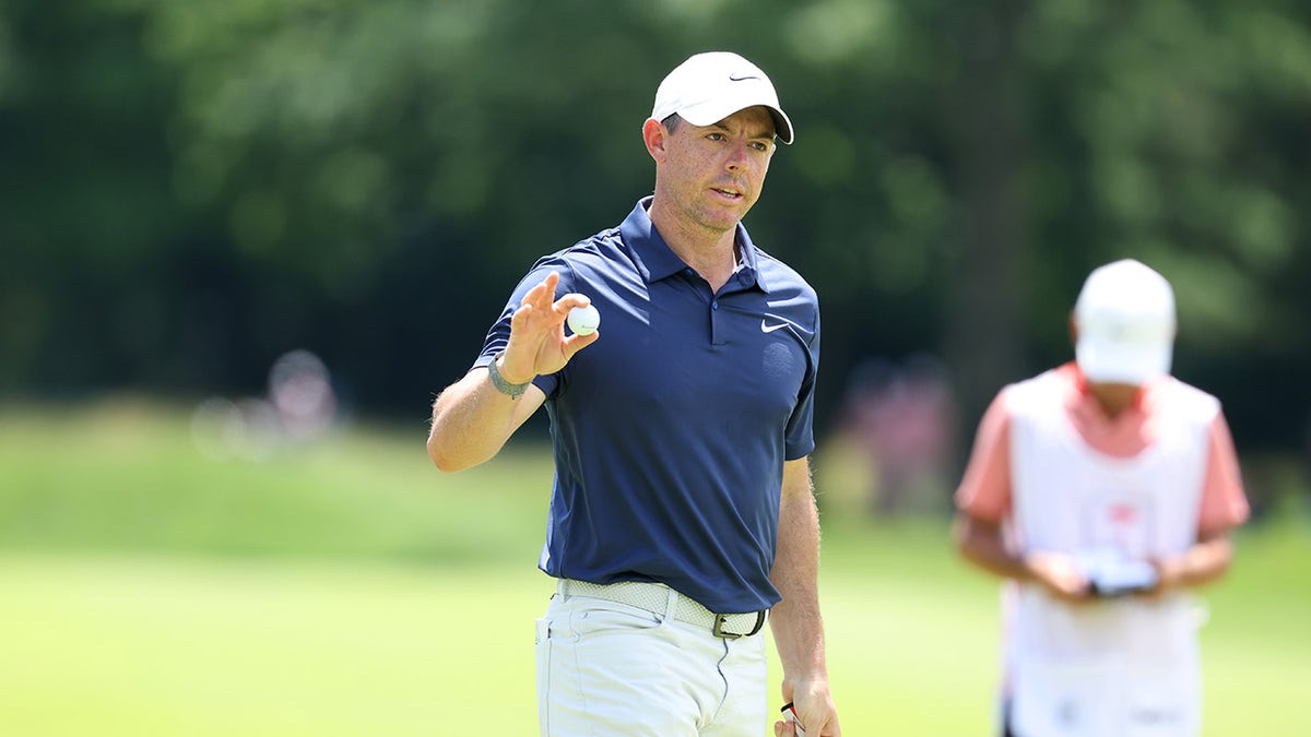 Rory McIlroy waves to the crowd