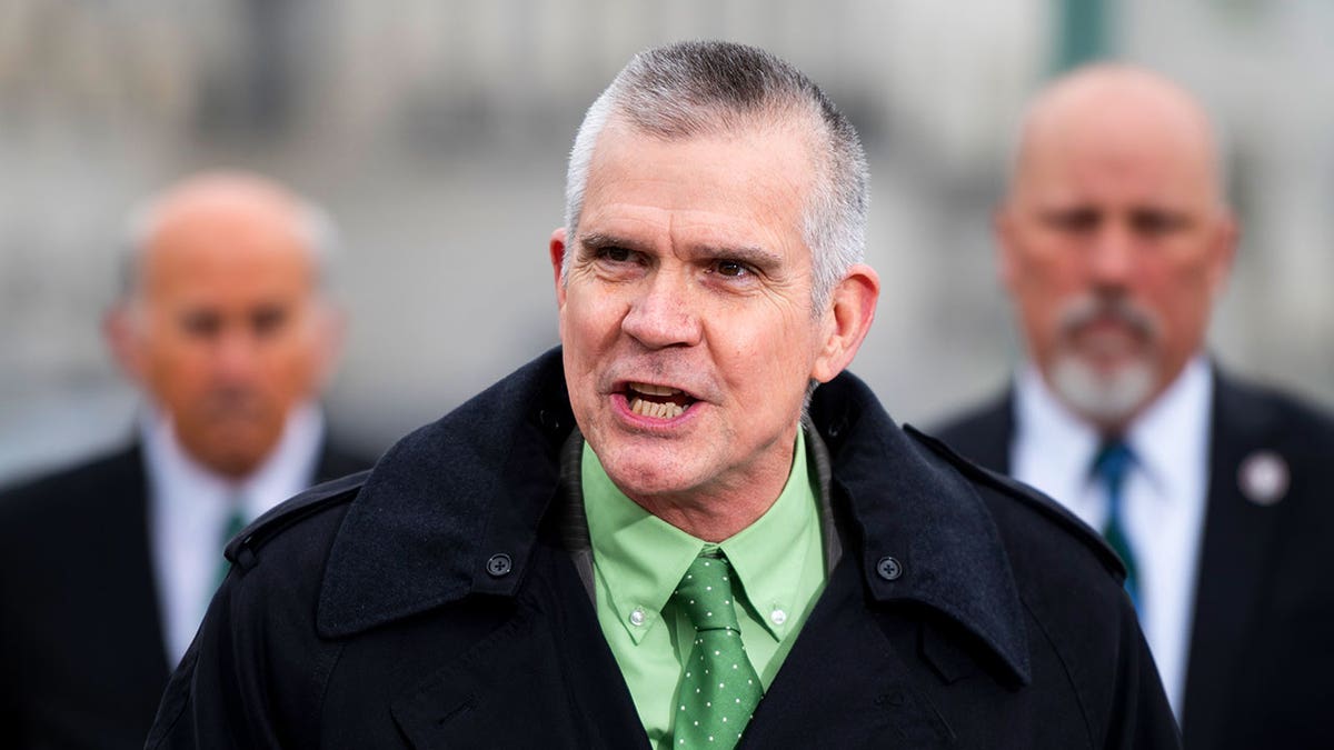 Rep. Matt Rosendale seen outside the Capitol building speaking in a suit