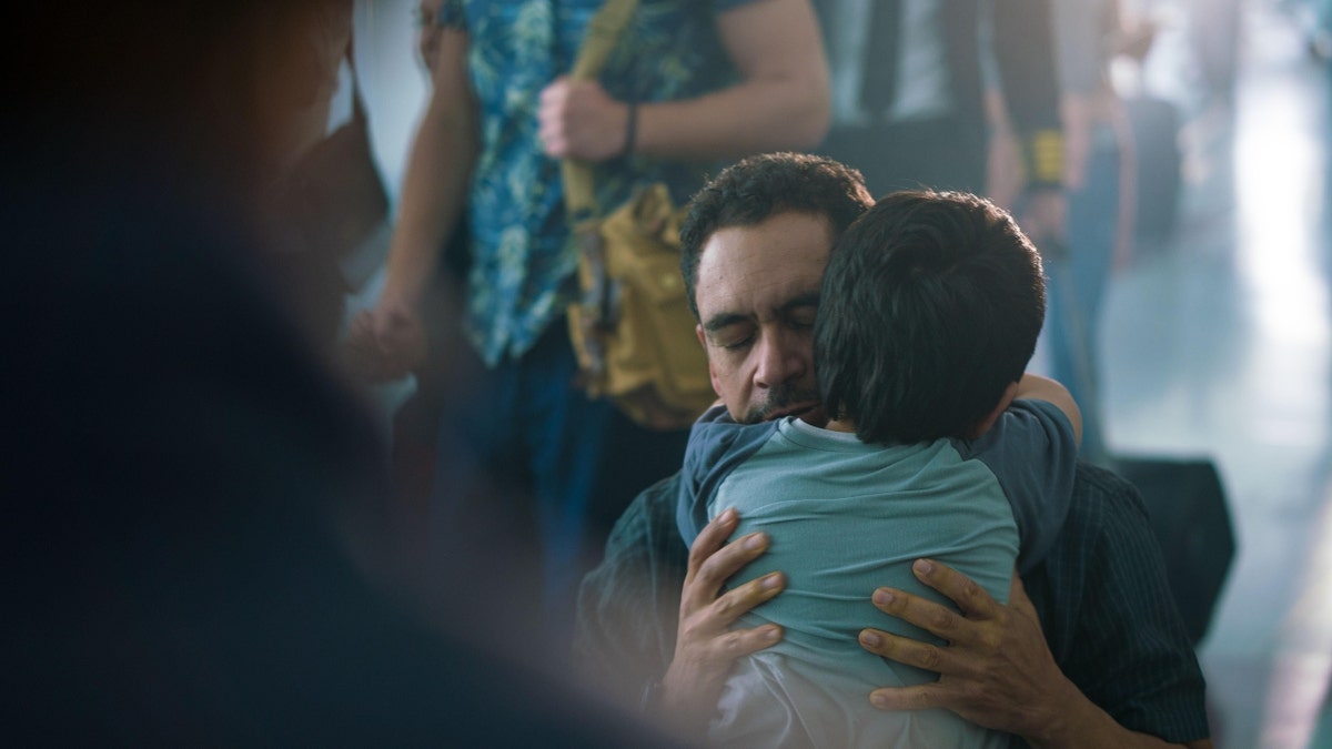 A scene from 'The Sound of Freedom' when a father and son are reunited