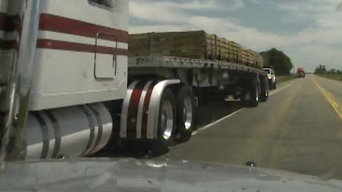Moment before stolen police car hits tractor-trailer on Highway 50 in Colorado