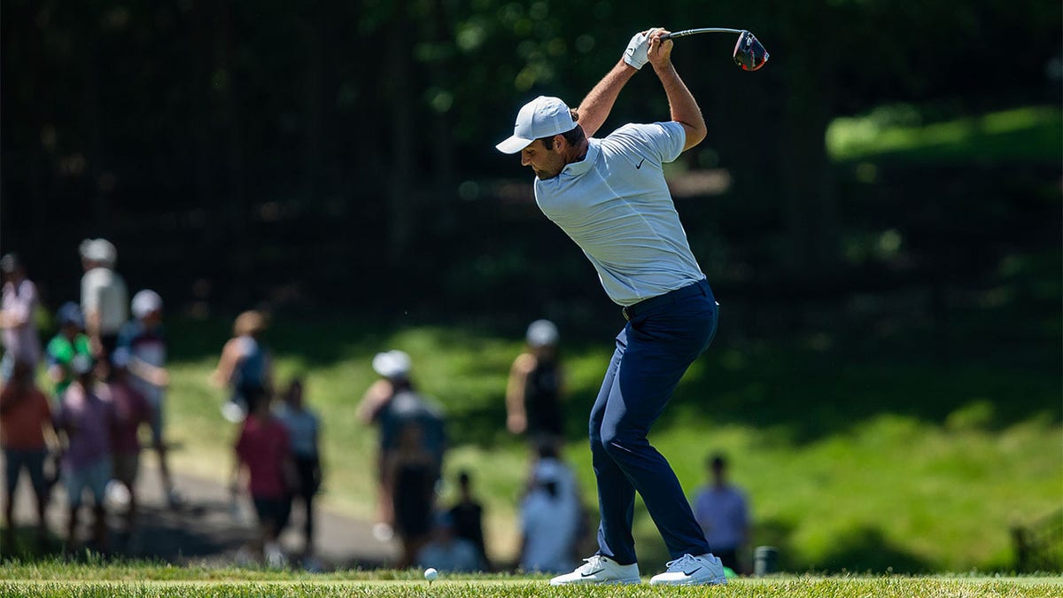 Scottie Scheffler tees off