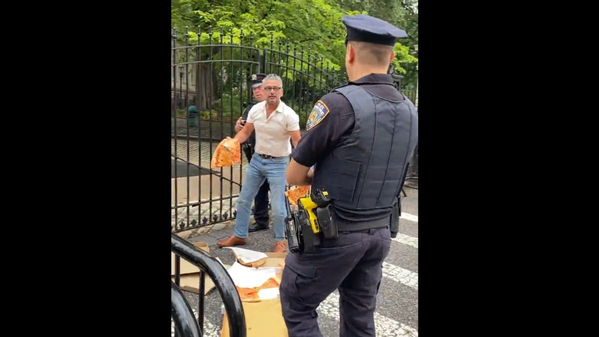 LoBaido said it was the "New York Pizza Party" as his demonstration was interrupted by two NYPD officers.
