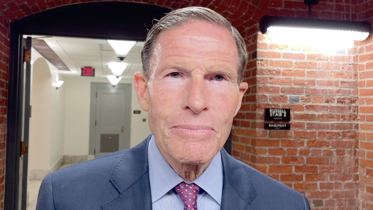 Sen. Richard Blumenthal interviewing in a senate basement hallway