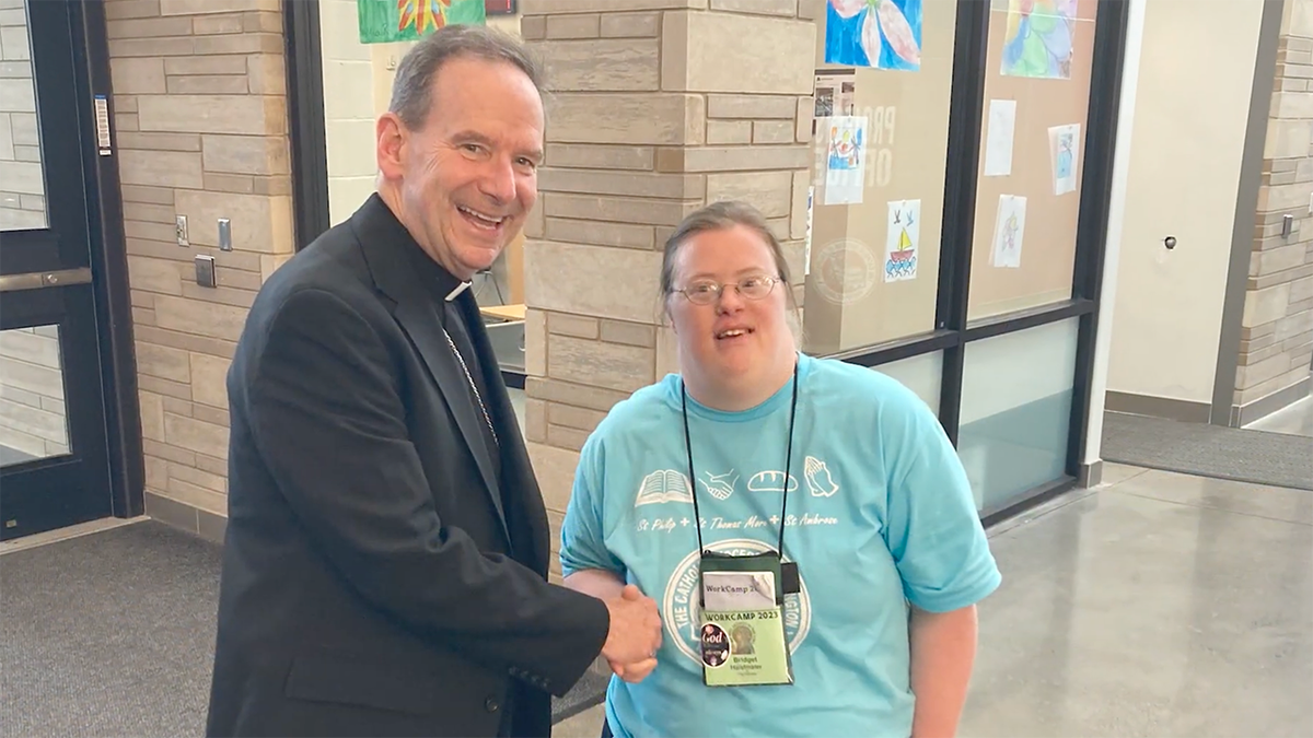 Bishop of Arlington with a young woman with Down Syndrome