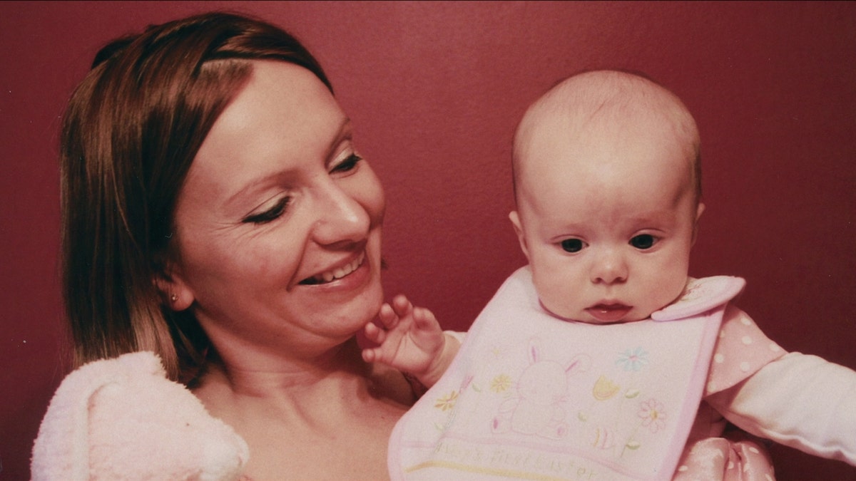 Beata Kowalski holding Maya as a baby