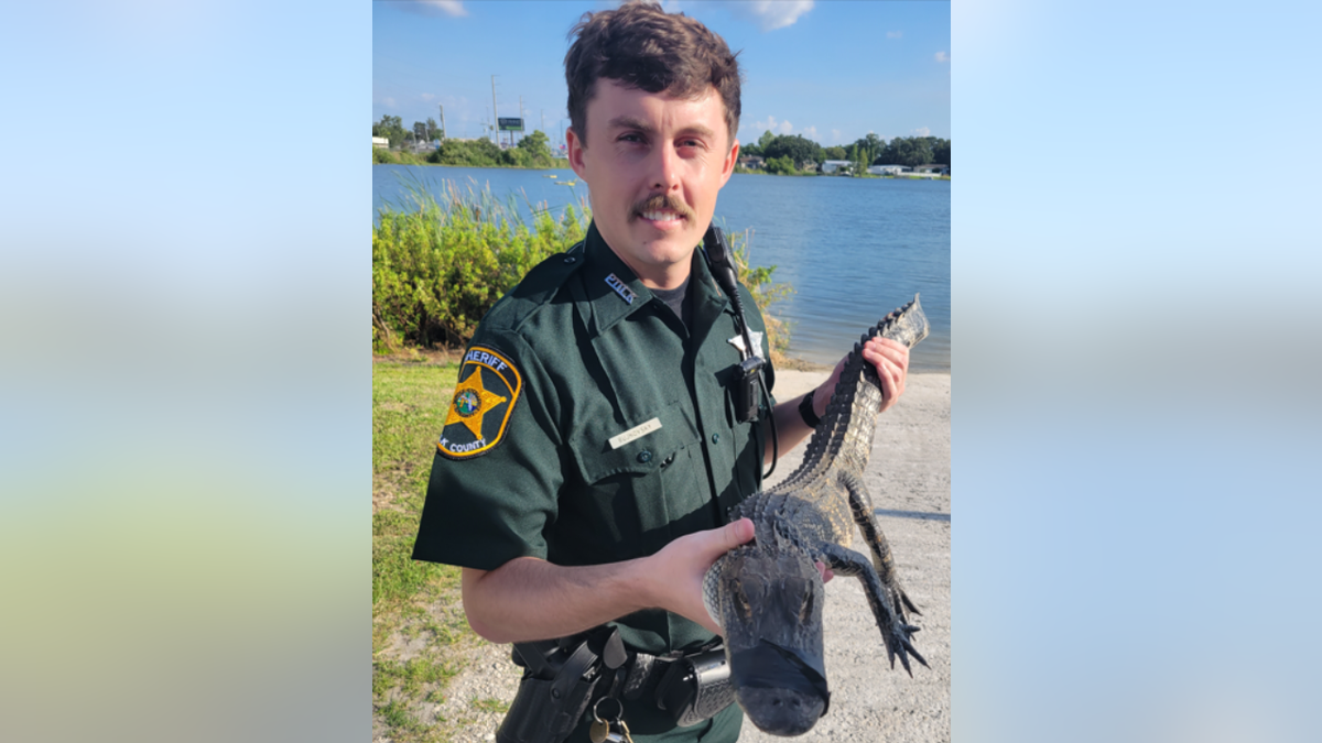 Deputy Sheriff Bujnovsky and gator