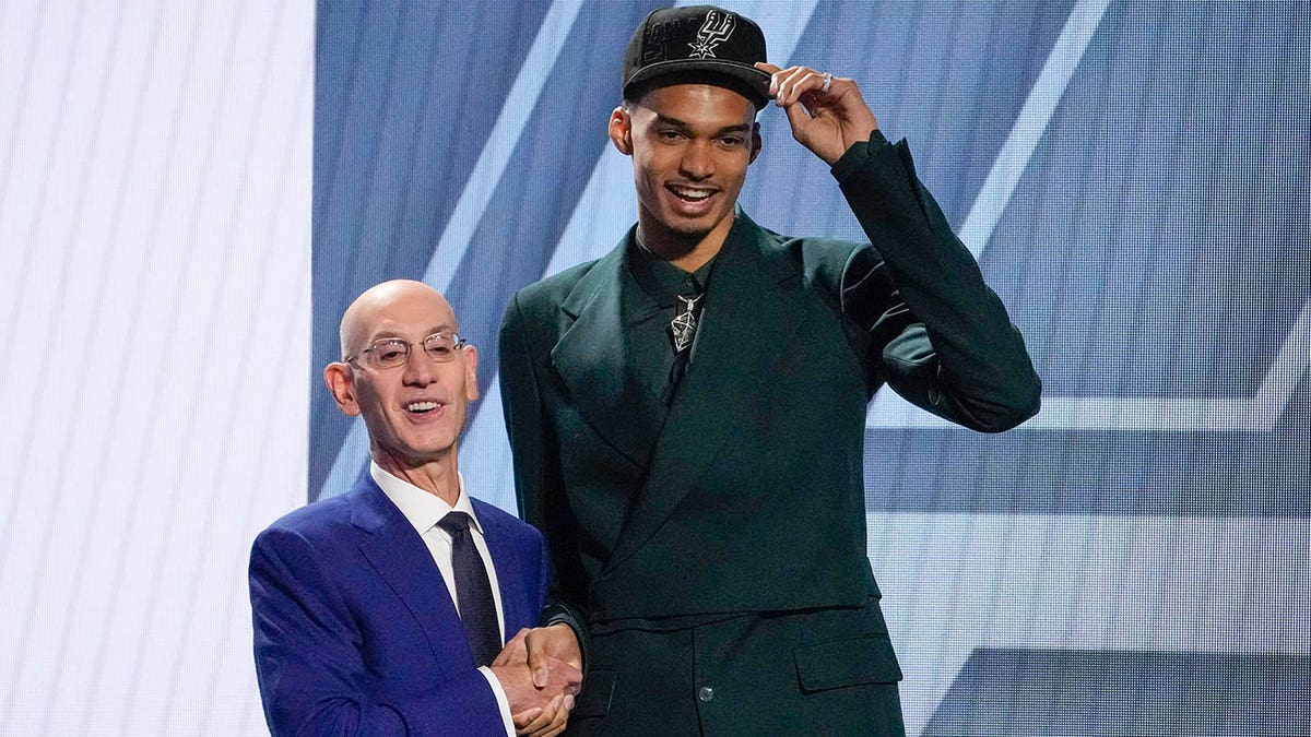 Victor Wembanyama and NBA commissioner Adam Silver