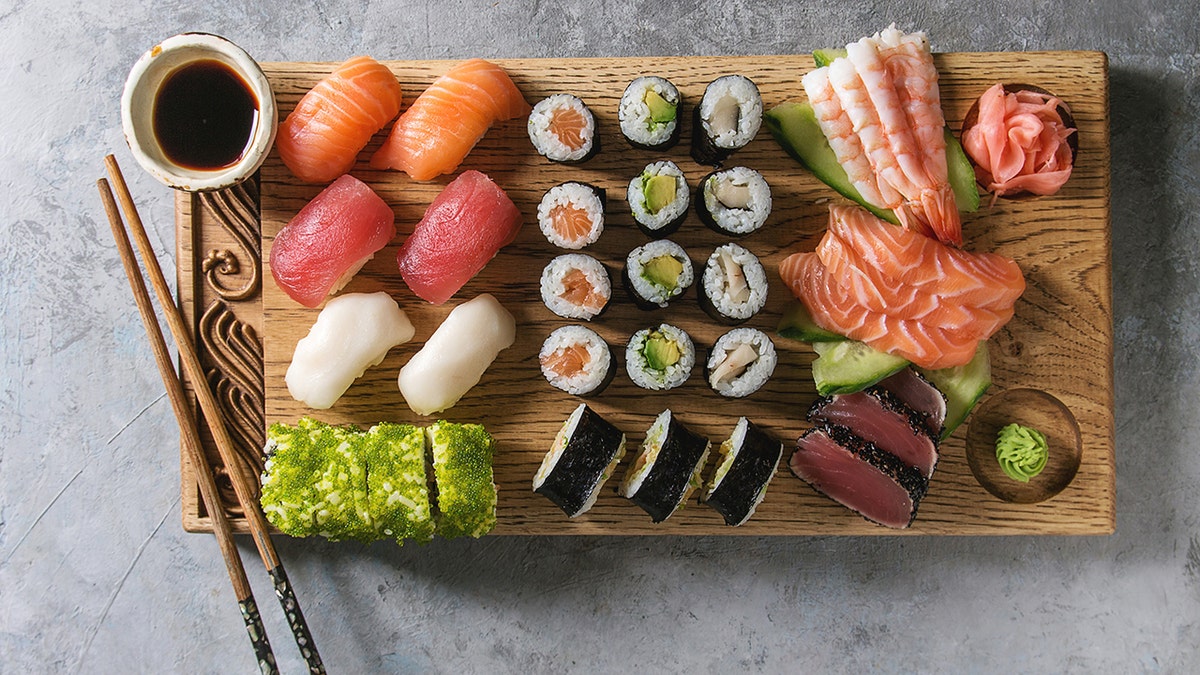 An assortment of sushi is shown on display.