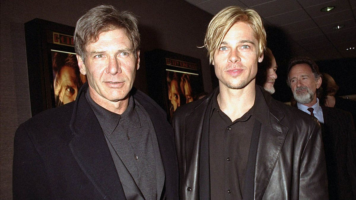 Harrison Ford and Brad Pitt wear matching black blazers to film premiere