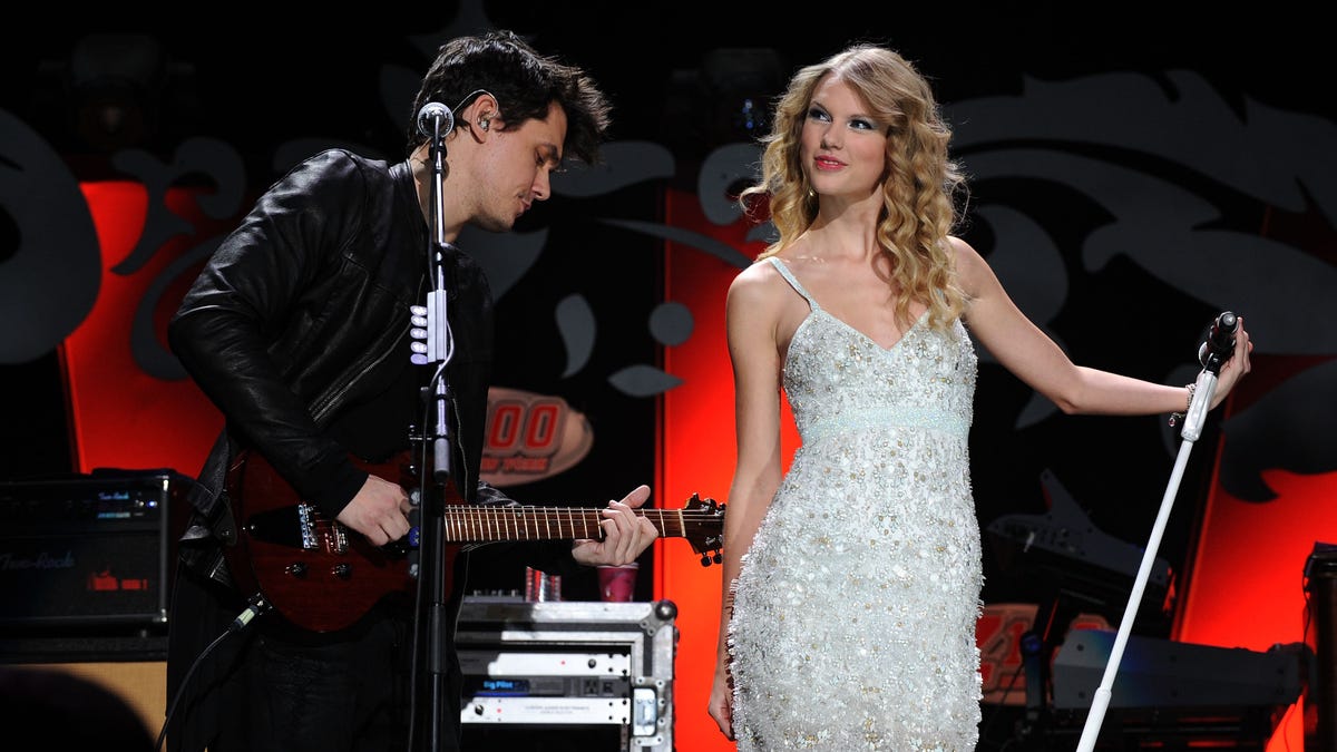 John Mayer and Taylor Swift performing onstage