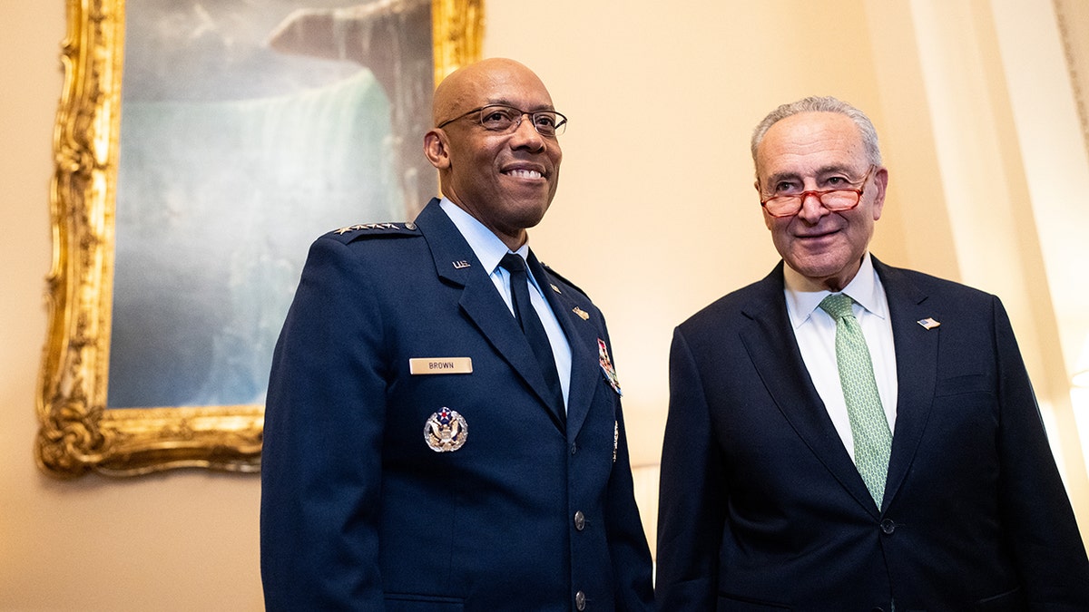 Gen. Charles Q. Brown stands next to Sen. Chuck Schumer, D-N.Y.