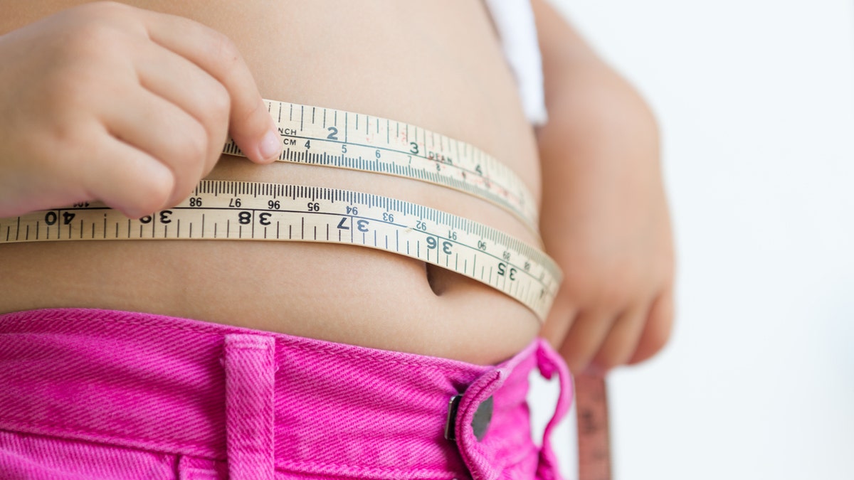 Child measuring stomach