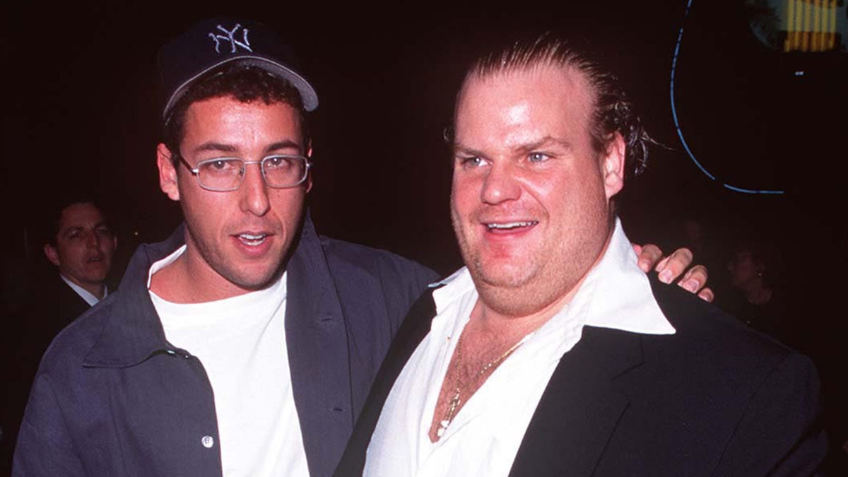 Adam Sandler wraps his arm around Chris Farley