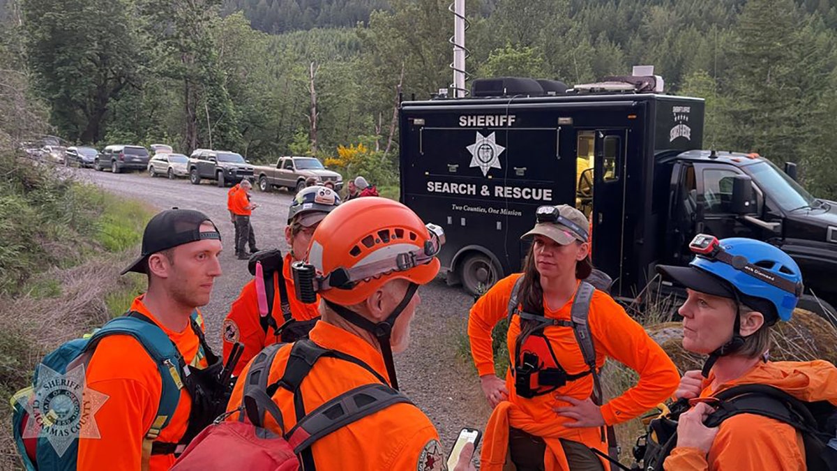 search team gathered on road