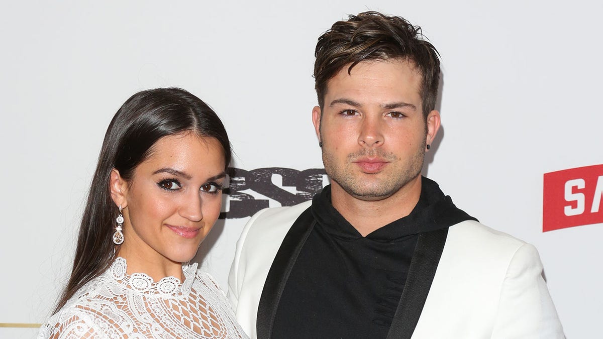 Cody Longo and Stephanie Longo walk red carpet at pre-Grammys party