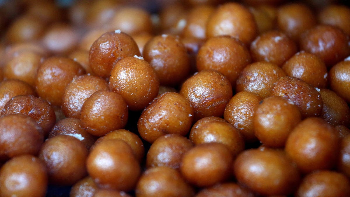 Gulab jamuns, a traditional Indian dessert, are on display for sale at a sweets shop in Mumbai, India, April 20, 2018. A study found that diabetes is more common among Indians than previously estimated. 