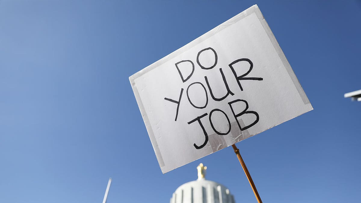 "Do your job" sign