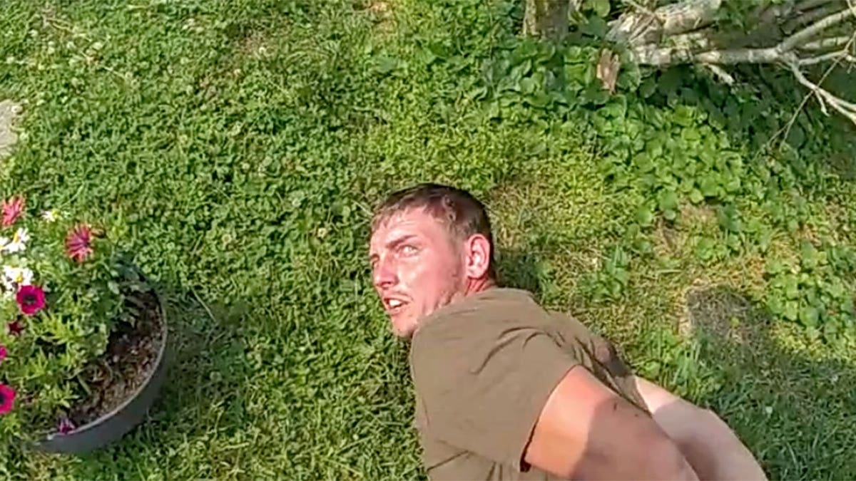 Ohio dad Chad Doerman handcuffed on the ground