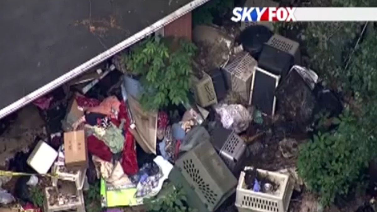 Dog crates piled outside Barbara Wible's home