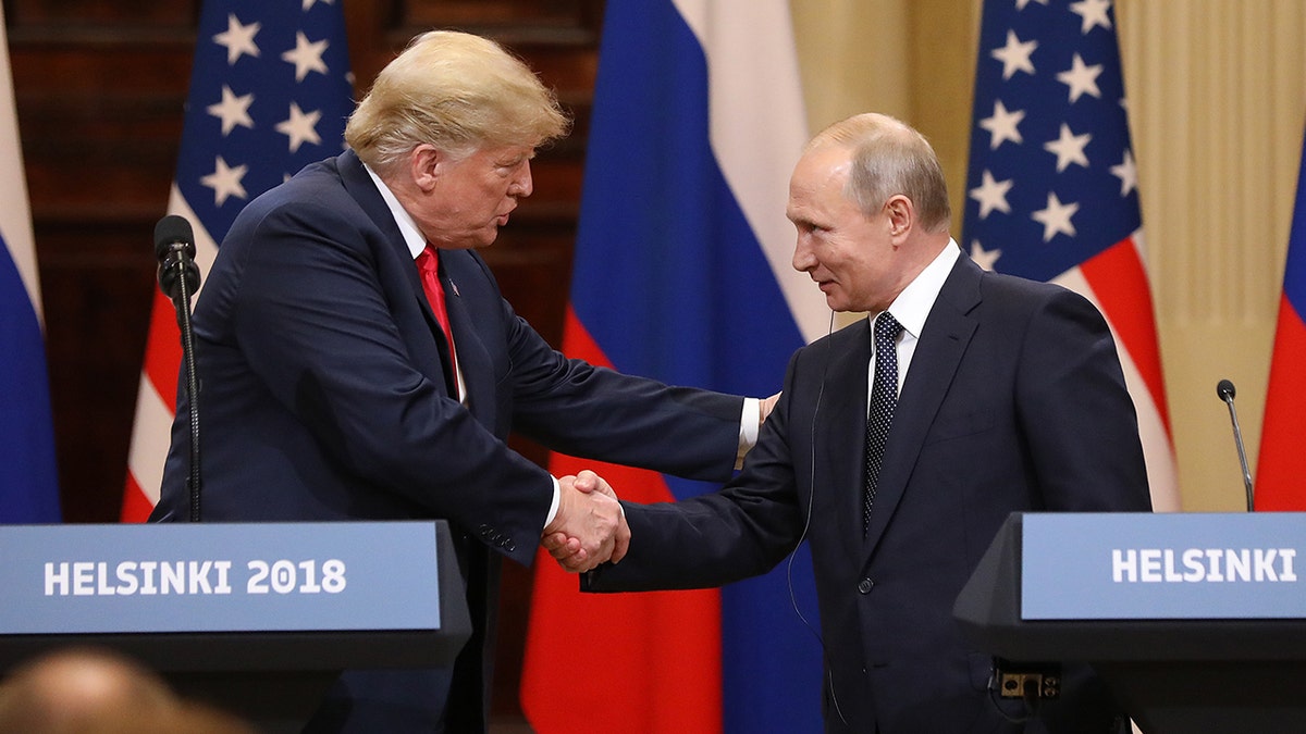 President Trump shakes hand with Russian President Vladimir Putin during a news conference in Helsinki, Finland