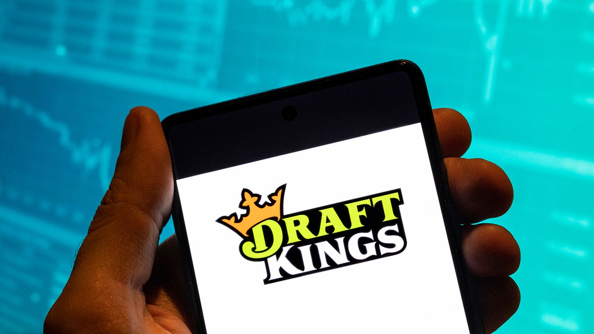 The DraftKings logo on a phone