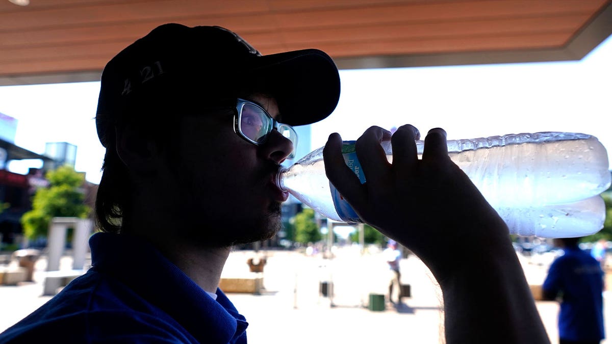 man drinks water