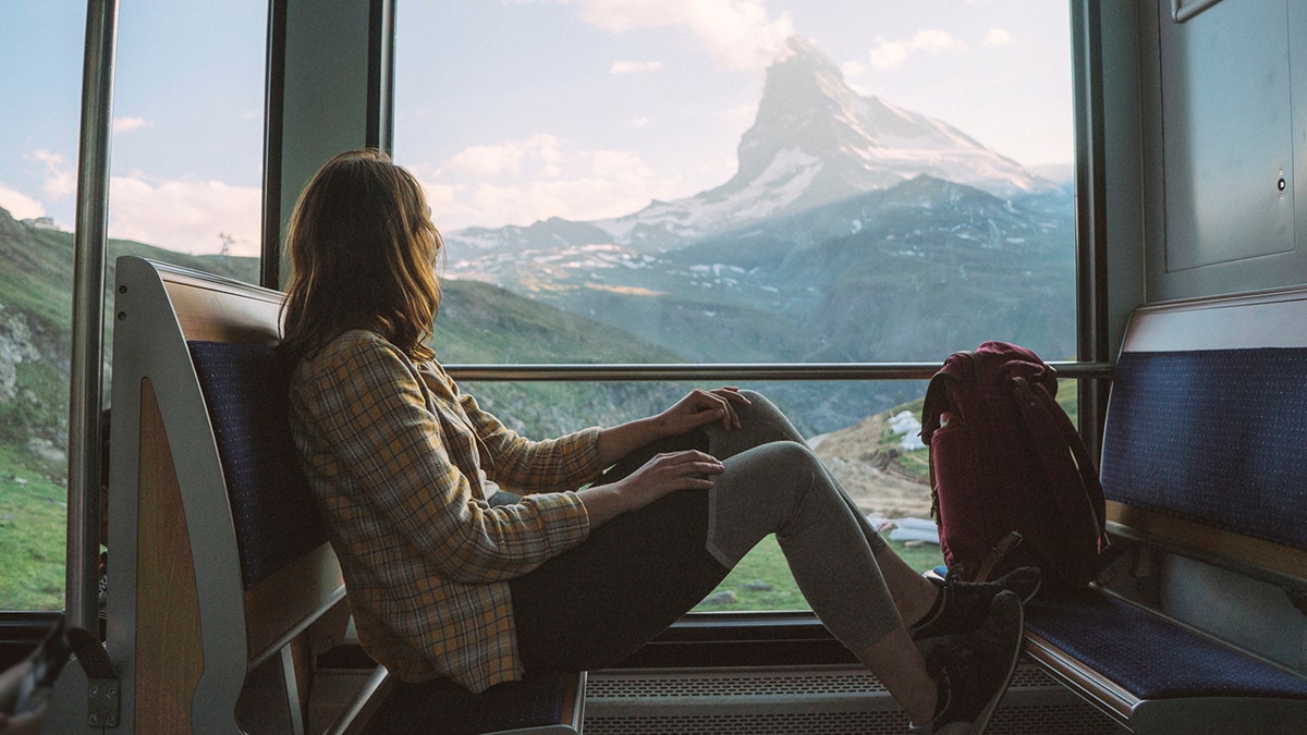 Woman traveling on train