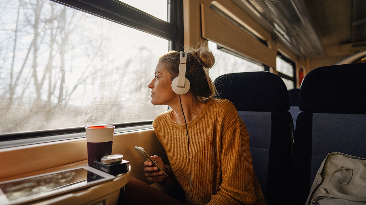 young woman traveling on train